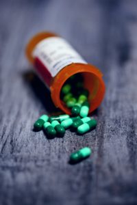 shallow focus photography of prescription bottle with capsules anxiety